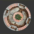 Rustic Stone Well Structure With Circular Red Gray Brick Border And Green Plants On Top