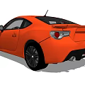 Orange Two Door Sports Car With Black Alloy Wheels And Sleek Exterior Design