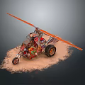 Custom Three Wheeled Vehicle With Orange Propeller And Decorative Parts In Sand