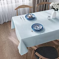 Bright Sunlit Minimalist Dining Room With Natural Wood Chairs And Soft Light Blue Tablecloth