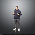 Smiling Man Wearing Blue Hoodie Gray Pants White Sneakers Giving Thumbs Up Against Gray Background