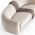 Beige Multi Seat Sofa With Brown Woven Throw And Curved Design 3d model