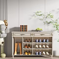 Modern White Shoe Cabinet Featuring Shoes Books Fruit Basket and Green Plant
