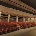 Spacious Conference Room With Rows Of Seats Large Screen And Wooden Ceiling
