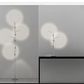 Modern Minimalist Floor Lamp With Circular Light Projections And Sleek Metal Stand Design