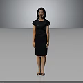 Elegant Woman In Black Dress Standing Against Gray Background With Confident Pose And Heels