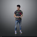 Man holding tablet in colorful striped T-shirt blue jeans and sneakers standing against gray background