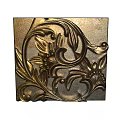 Intricate Carved Metallic Decor Featuring Floral Scrolls And Leaf Patterns