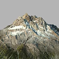 Mountain Terrain With Snow Covered Peaks Rocky Slopes And Green Vegetation