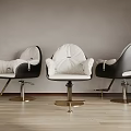 Three Modern Black And White Massage Chairs Featuring Gold Base Gray Wall And Wooden Floor