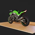 Green And Silver Modern Sport Motorcycle With Black Seat Accent Wheels On Display Stand