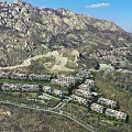 Aerial Planning of Residential Complex With Mountainous Surroundings Multi Story Buildings Roads and Green Spaces