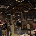 Modern Restaurant Interior With Colorful Chairs Wooden Ceiling Large Windows And Pink Flowers