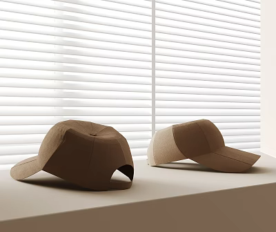 Two Brown Hats Placed On White Tabletop In Front Of White Blinds 3d model