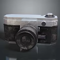 Vintage Electronic Camera With Worn Metal Leather Body Lens And Control Buttons