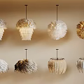 Various Styles of Feather Chandeliers in Neutral Tones Displayed on Beige Wall