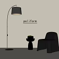 Black Leather Leisure Chair with Small Side Table Potted Plant and Floor Lamp