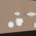 White Hanging Pendant Lights with Various Shapes and Paper Texture Against Light Beige Wall