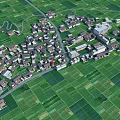 Aerial View Of Rural Village With Green Fields And Traditional Houses