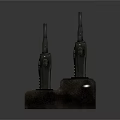 Multiple Black Walkie Talkies Charging On Desktop Dock Station For Communication