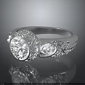 Exquisite Silver Ring With Intricate Floral Engravings And Decorative Round Motif