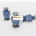 Elegant Blue And White Ceramic Vases With Brass Bases And Intricate Patterns