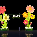 Vibrant Illuminated Event Gateway With Colorful Flower Decorations And Green Base