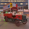 Vintage Red Double Decker Bus With DETARS And FUNNY DRIVER Signs On City Street