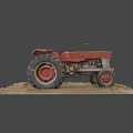 Old Red ENOR Utility Tractor with Large Tires on Dirt Ground