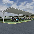 Electric Vehicle Charging Station With White Canopy And Multiple Colored Cars On Green Ground