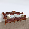 Classic Leather Sofa Set With Ornate Carved Wooden Frame And Decorative Pillows
