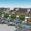 Traditional Chinese Commercial Street With Trees Fountains Stone Paved Walkway And Outdoor Seating