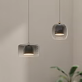 Modern Pendant Lights With Black Glass Shades And Metal Accents For Minimalist Interior
