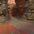 Natural Rocky Crevice With Rough Rock Walls And Scattered Red Sand Pathway