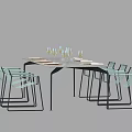 Modern Dining Table Set With Black Metal Legs And Light Green Chairs