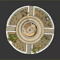 Garden Ornament Circular Tiered Fountain Surrounded by Small Plants and Stone Borders