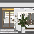 Modern Minimalist Dessert Shop Interior With Display Case Fresh Pastries Green Plants Hanging Lights And Wooden Tables