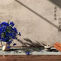 Blue Flowers in Ceramic Vase with Scrolls Tea Set on Wooden Surface and Textured Wall