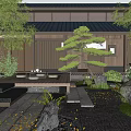 Traditional Japanese Garden Courtyard With Wooden Structure Stone Paths And Lush Greenery