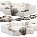 Modern Sectional Sofa Design With Soft Pillows And Cozy Throw Blanket In Neutral Tones