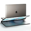 Two Sleek Silver Laptops With Open Vibrant Screens And Apple Logo Design
