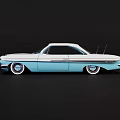 Classic Vintage Blue And White Car With Streamlined Body Chrome Accents And Wheels