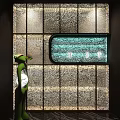 Textured Background Wall With Illuminated Decorative Panel And Metallic Accents