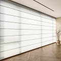 Large White Light Filtering Blinds In Bright Interior With Wooden Floor And Decorative Plant