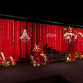 Elegant Banquet Hall With Red Floral Decorations And Wedding Stage Setup