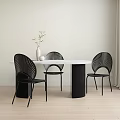 Oval White Marble Dining Table with Black Striped Legs and Black Chairs in Modern Interior