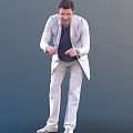Man in Light Suit Jacket Dark Shirt and Tie Standing Against Gray Background
