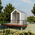 White Exterior Cabin With Large Windows Wooden Deck Black Railings Green Trees And Yellow Flowers