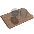 Transparent Glass Cups Placed On Wooden Tray With Small Metal Dish