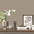 Decorative Ornament Collection On Wooden Shelf With Calla Lilies Books And Framed Art